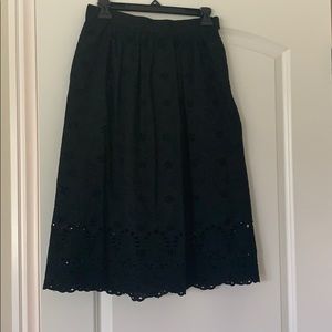 H&M black eyelit dress with pockets.
